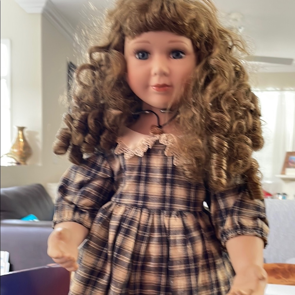 Ashley bell porcelain doll 21 inches tall on stand. Great for collector.